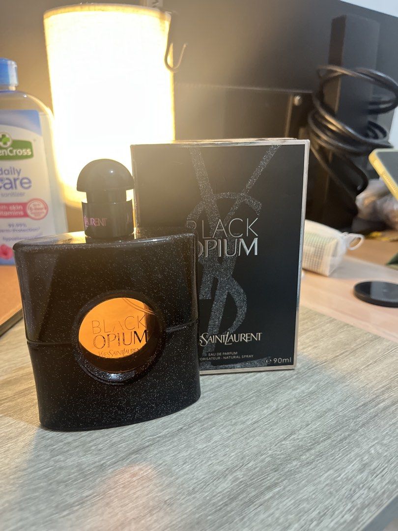 Yves Saint Laurent Black Opium Eau de Parfum (Category: Fragrance & Deodorants) located in Manila. Submitted by checkmylisting (Listing ID 1421560443, Image 3). Description: - Yves Saint Laurent Black Opium Eau de Parfum - 90ml bottle - Black bottle and box with glittery accents - Bottle features a clear window with "Black Opium" visible - Box displays brand and product name.