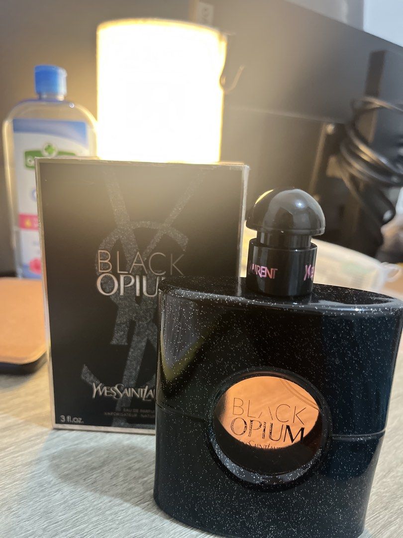 Yves Saint Laurent Black Opium Eau de Parfum (Category: Fragrance & Deodorants) located in Manila. Submitted by checkmylisting (Listing ID 1421560443, Image 2). Description: - Yves Saint Laurent Black Opium Eau de Parfum - 90ml bottle - Black bottle and box with glittery accents - Bottle features a clear window with "Black Opium" visible - Box displays brand and product name.