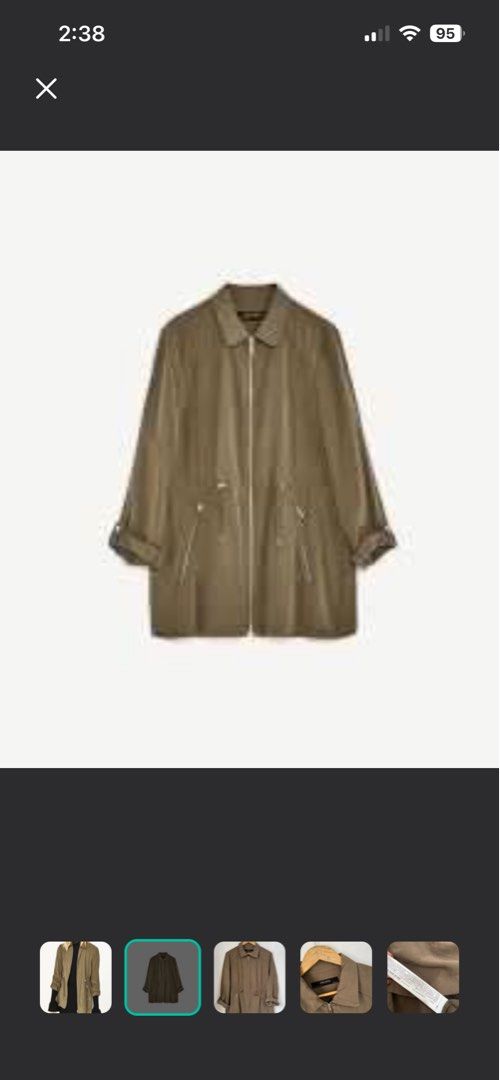 Zara Olive Green Jacket (Category: Coats, Jackets and Outerwear) located in Makati City. Submitted by skippydeclutters (Listing ID 1421510497, Image 2). Description: - Zara jacket - olive green color but with discoloration - Zip-up front - Drawstring waist - Long sleeves (can be rolled up) - Two front pockets - Collar - Lightweight, ideal for layering.