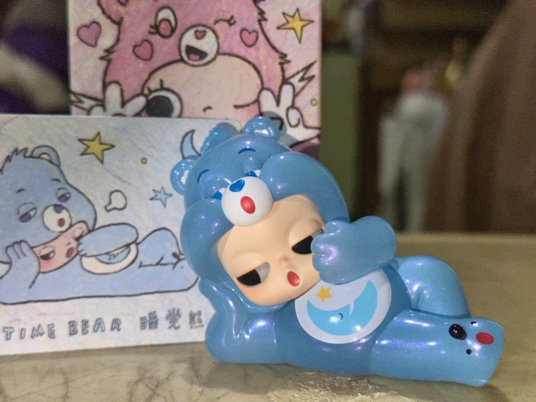Zsiga Care Bears Time Bear Popmart (Category: Designer & Blind Box Toys) located in Manila. Submitted by hannatewakuso (Listing ID 1421547760, Image 1). Description: - Ziga Care Bears Time Bear figure - Features a blue bear design - Includes original box and collectible card - Purchased from Filbar’s One Ayala today (02.14) RFS: I dont like it, lol it was an impulse buy Ships from Metro Manila.