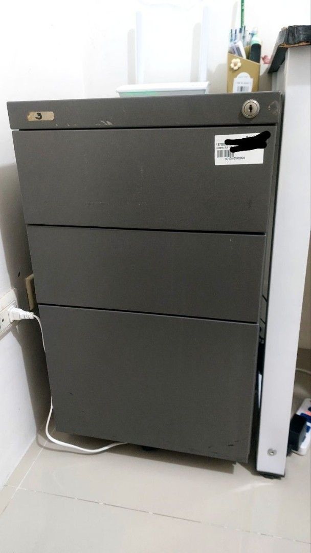 3-Drawer Metal Filing Cabinet (Category: Office Furniture & Fixtures) located in Cavite. Submitted by bryanbr (Listing ID 1421717163, Image 1). Description: - Durable metal filing cabinet - Three smooth-sliding drawers - Dark gray color - Approximately 26 inches tall - Perfect for home or office use - Ideal for organizing documents and supplies.