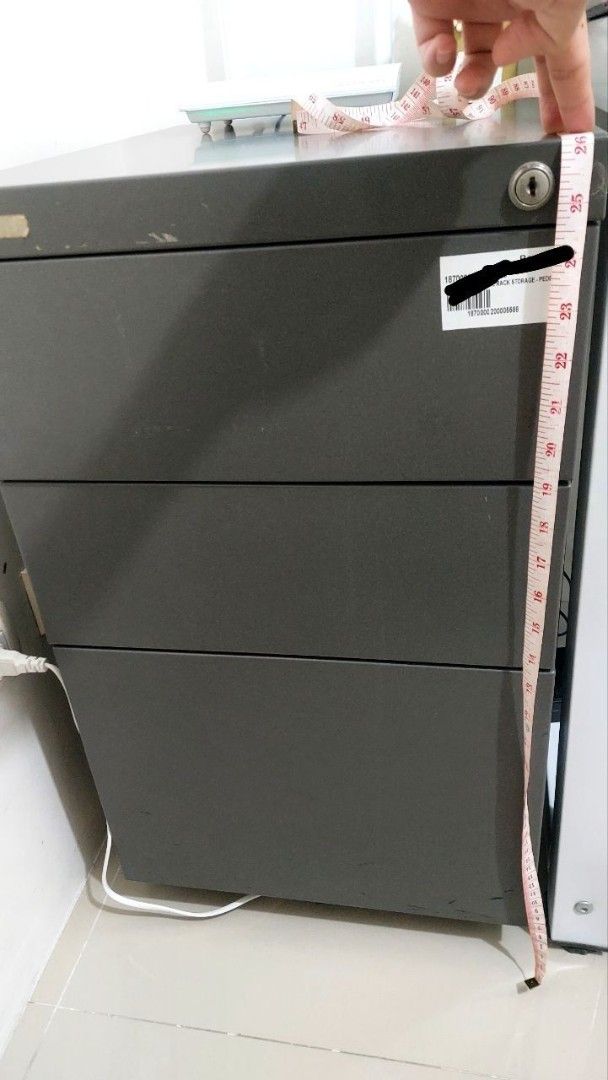 3-Drawer Metal Filing Cabinet (Category: Office Furniture & Fixtures) located in Cavite. Submitted by bryanbr (Listing ID 1421717163, Image 3). Description: - Durable metal filing cabinet - Three smooth-sliding drawers - Dark gray color - Approximately 26 inches tall - Perfect for home or office use - Ideal for organizing documents and supplies.