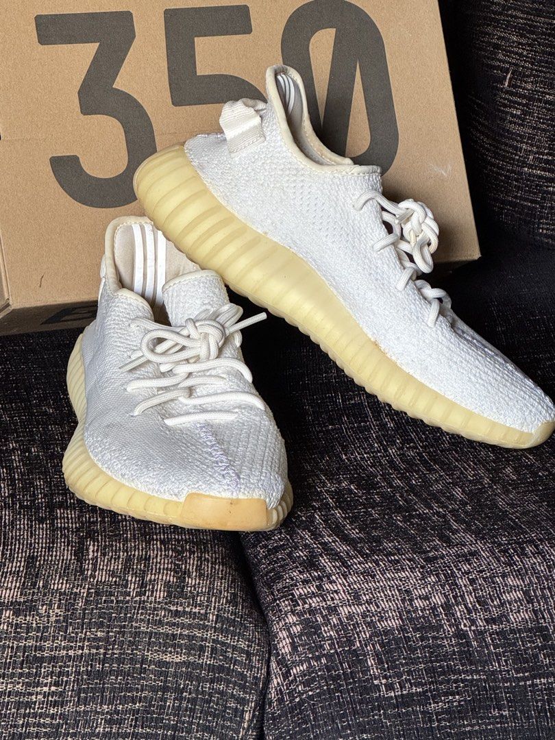 Adidas Yeezy Boost 350 V2 - White (Category: Sneakers) located in Muntinlupa City. Submitted by cher_ami (Listing ID 1421629455, Image 3). Description: - Adidas Yeezy Boost 350 V2 - Color: White - Size: US 8 - Includes original box - Features: - White upper - White laces - Light yellow sole - Adidas logo on insole - Yeezy Boost 350 V2 label on box.