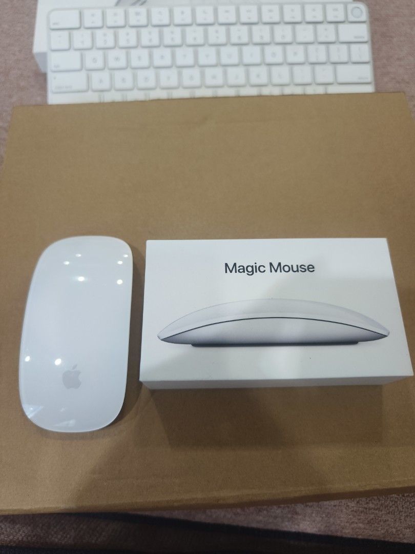 Apple Magic Mouse 2 (Category: Mouse & Mousepads) located in Kuala Lumpur. Submitted by alanchong77 (Listing ID 1421702360, Image 3). Description: - Apple Magic Mouse 2 included. - Comes with the original box. - Color: White. - Features the Apple logo. - Mouse shows some wear on the bottom. - In 100% working condition. great mouse for Mac users, nego till go....