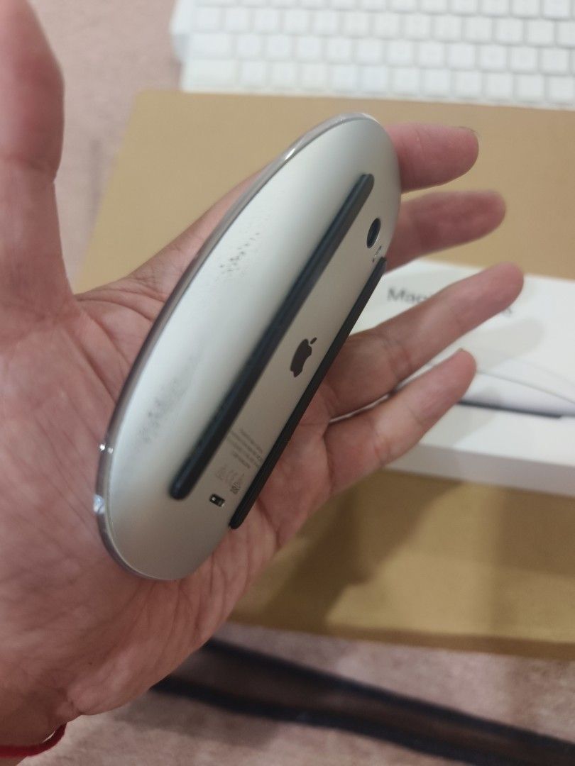 Apple Magic Mouse 2 (Category: Mouse & Mousepads) located in Kuala Lumpur. Submitted by alanchong77 (Listing ID 1421702360, Image 2). Description: - Apple Magic Mouse 2 included. - Comes with the original box. - Color: White. - Features the Apple logo. - Mouse shows some wear on the bottom. - In 100% working condition. great mouse for Mac users, nego till go....