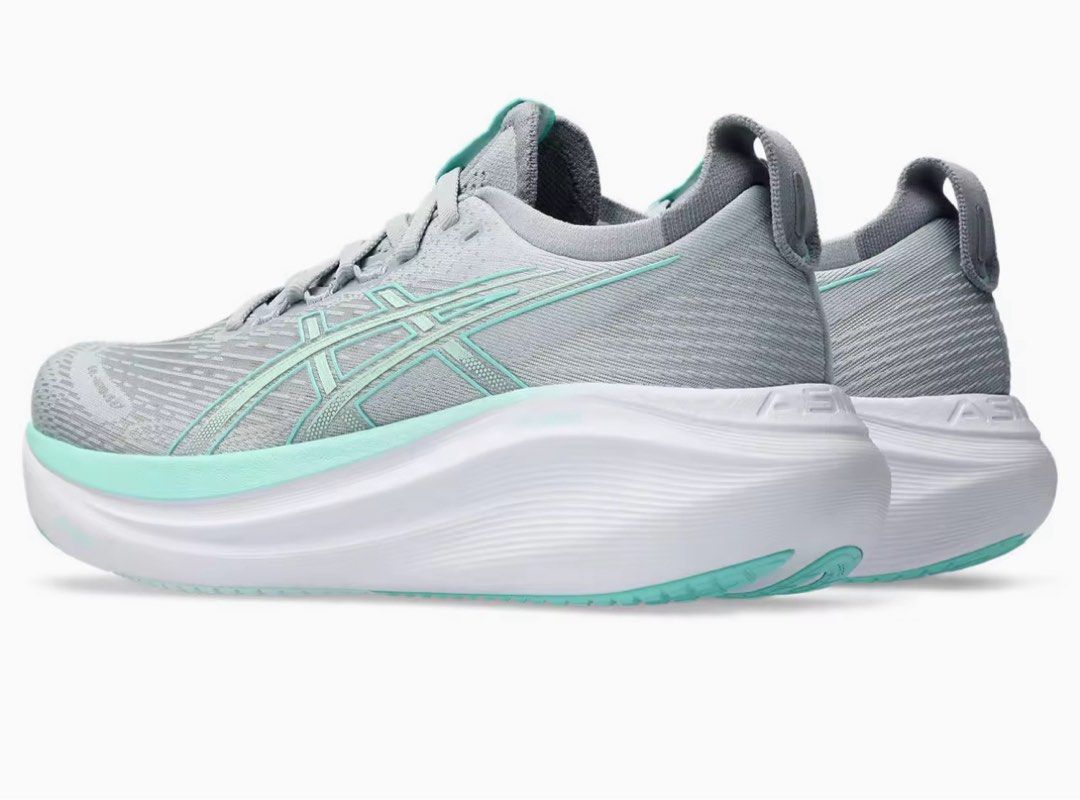 ASICS Women GEL-NIMBUS 27 WIDE Running Shoes in Piedmont Grey/Illuminate Mint (Category: Sneakers) located in Singapore. Submitted by silver15 (Listing ID 1421752106, Image 3). Description: - Brand new Asics Gel-Nimbus 27 wide running shoes - Stylish grey and mint colorway - Designed for comfort and performance - Suitable for running and everyday wear - Comes with original packaging.