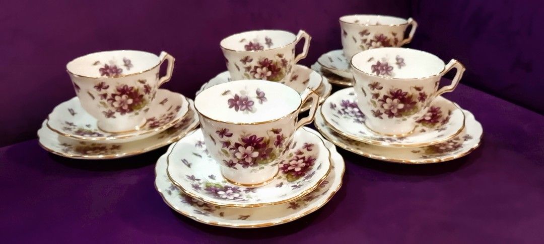Aynsley Violette Floral Tea Cup Set (Category: Coffee & Tea Tableware) located in Cabanatuan. Submitted by miss.maia (Listing ID 1421775304, Image 2). Description: -Brand: Aynsley. Pattern: Violette, -featuring purple violets and gold trim. -Material: Fine bone china. -Origin: Made in the United Kingdom - Vintage teacup set - Purple floral design with gold trim - Includes cups, saucers, and side plates - Perfect for serving tea or display -1580 p