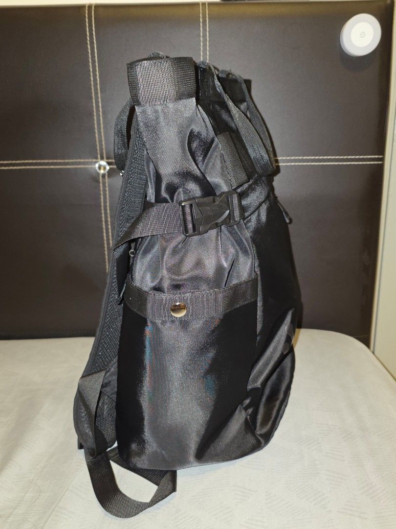 Black Backpack (Category: Backpacks) located in Kuala Lumpur. Submitted by lovismart (Listing ID 1421757777, Image 3). Description: - Black backpack - Multiple compartments for storage - Adjustable shoulder straps - Top handle for easy carrying - Durable, possibly water-resistant material - Secure closure with buckles and D-rings - Suitable for various items.