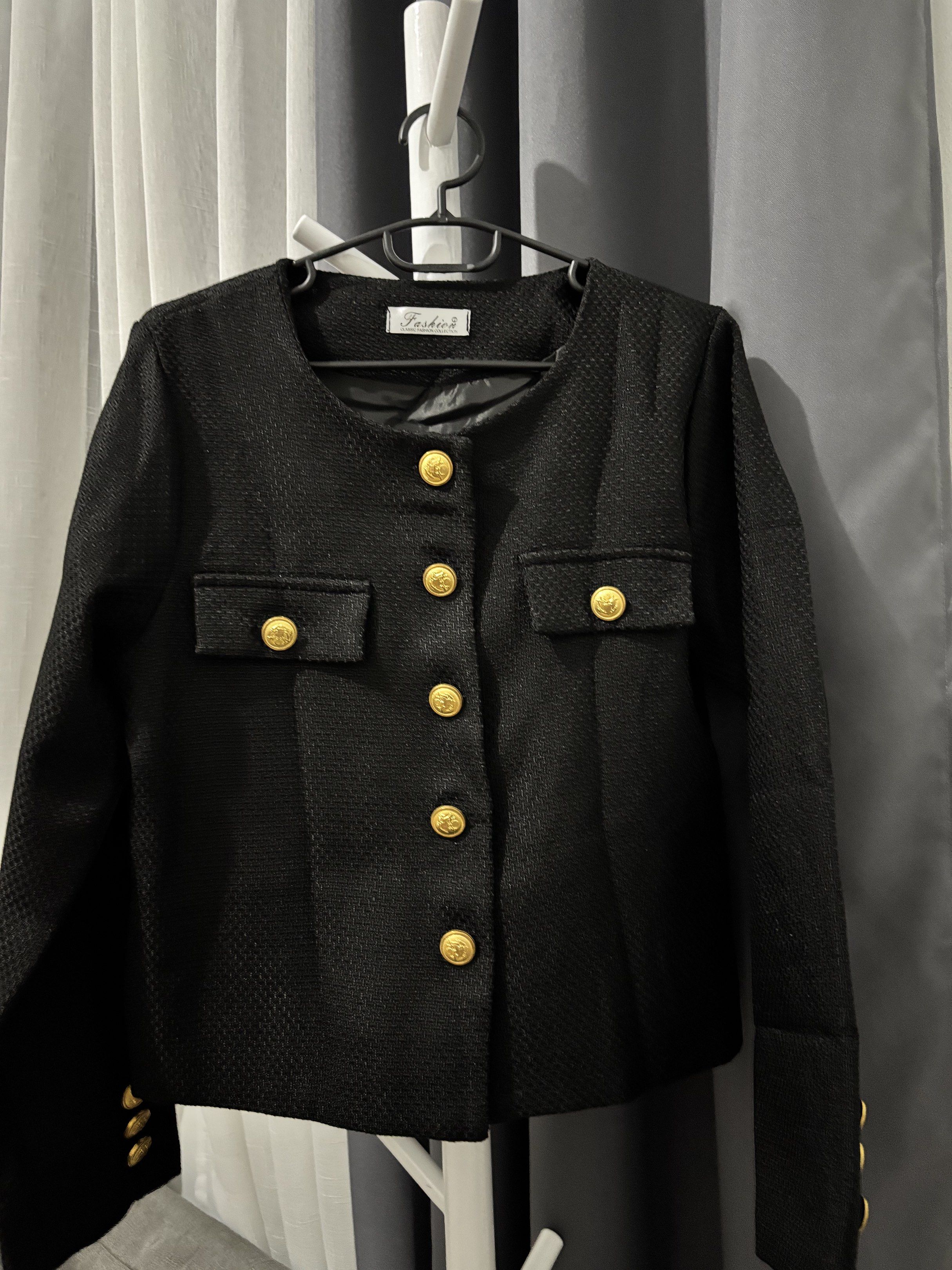 Black Blazer with Gold Buttons (Category: Coats, Jackets and Outerwear) located in Cavite. Submitted by clawsetangelaco (Listing ID 1421773775, Image 1). Description: - Black blazer with gold button details - Round neckline - Tailored fit - Two front pockets - Textured fabric - Lined interior - Gold buttons on sleeves.
