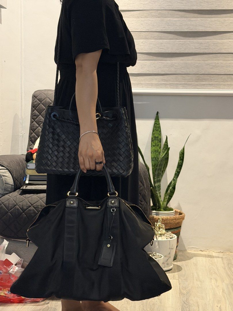 Michael Kors Travel Black Handbag (Category: Luxury Bags & Wallets) located in Rizal. Submitted by bubblesnow (Listing ID 1421724606, Image 3). Description: - Black handbag good for overnight bag, or handcarry travel bag. - Unique shape - Zipper closure - Made of a nylon-like material - partially negotiable .