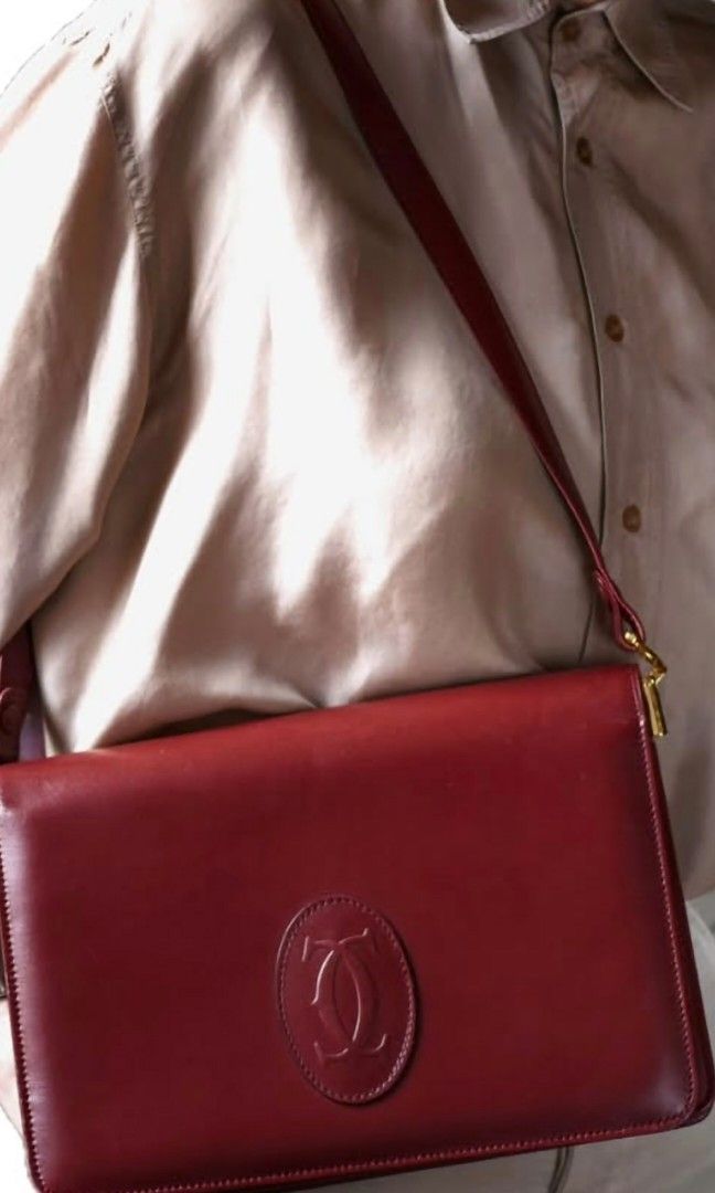 Cartier Shoulder Bag (Category: Luxury Bags & Wallets) located in Quezon City. Submitted by cncarousel (Listing ID 1421695529, Image 1). Description: - Authentic Cartier shoulder bag - Rich burgundy color - Classic design with Cartier logo - Adjustable shoulder strap - Gold-tone hardware - Spacious interior with small pocket - Perfect for everyday or special events compared with 2x,000.