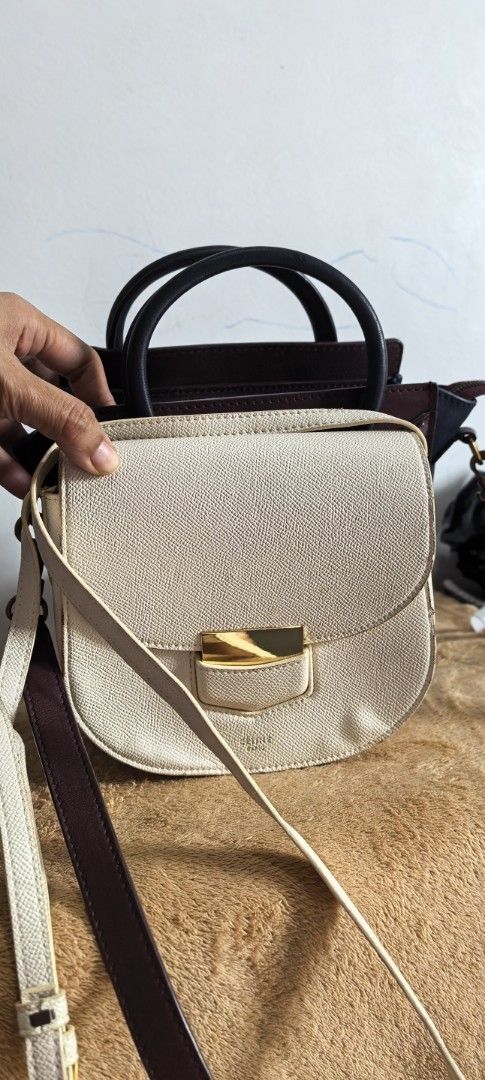 Celine small sling (Category: Luxury Bags & Wallets) located in Cagayan de Oro. Submitted by tommygurl1218 (Listing ID 1421790756, Image 2). Description: - Celine sling /crossbody bag Small size - Saddle bag shape - Flap closure - Gold-tone clasp - Made of textured leather - Celine logo detail - Long shoulder strap With sign of use.