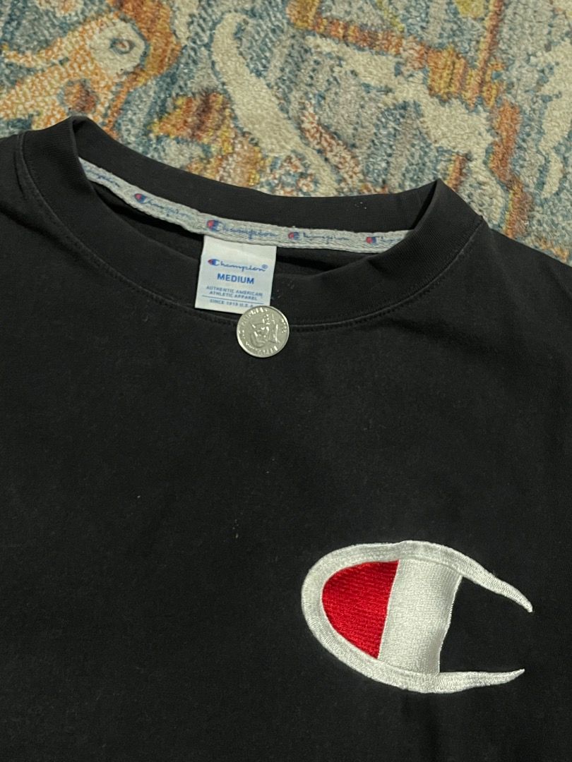 Champion x Evisu Black T-shirt (Category: Tshirts & Polo Shirts ) located in Manila. Submitted by ranjieee (Listing ID 1421752277, Image 2). Description: - Black Champion x Evisu T-shirt - Size: Medium - Neckline: Crew neck - Evisu design on the back - 21 x 23.5 - 8.5 color rate.