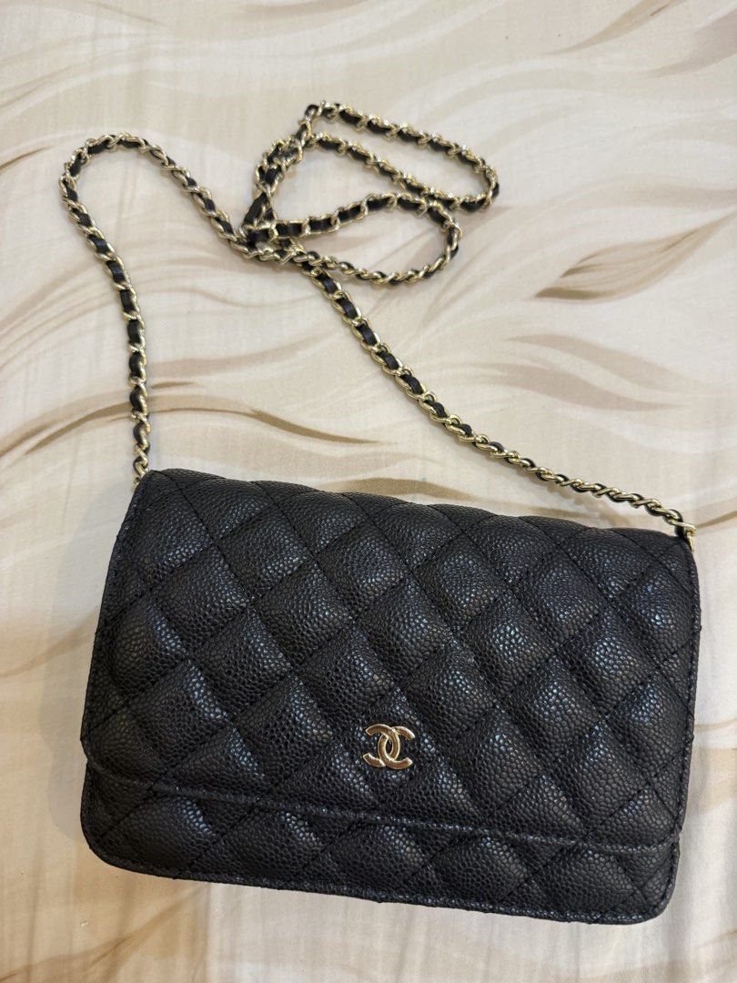 Chanel Wallet on Chain Black (Category: Luxury Bags & Wallets) located in Quezon City. Submitted by reeseberrychic (Listing ID 1421643207, Image 1). Description: - Authentic Chanel Wallet on Chain (WOC). - Classic black quilted design. - Features a gold-tone chain strap. - Interior includes multiple compartments and card slots. - Marked "CHANEL MADE IN ITALY"..