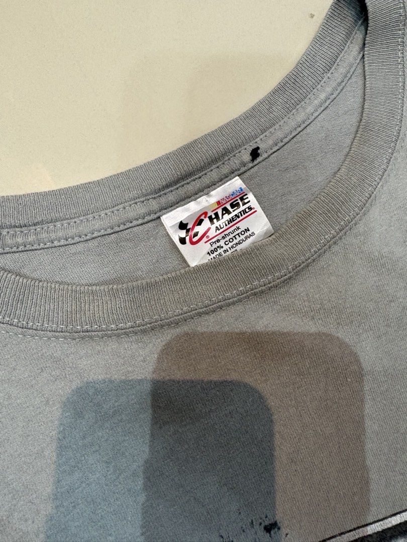 Chase Authentics Jeff Gordon #24 T-Shirt (Category: Tshirts & Polo Shirts ) located in Lipa City. Submitted by thriftopia_sj (Listing ID 1421659872, Image 3). Description: - Jeff Gordon #24 t-shirt - Gray color - Front design: "GORDON" and "24" with racing graphic - Back design: Red and black race car - Chase Authentics tag - Material: 100% cotton Dimes 27x32 Flaws : Stains (not sure if washable).