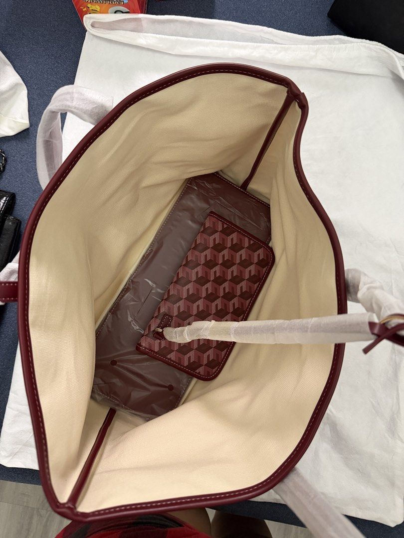 Christy Ng Tote Bag (Category: Tote Bags) located in Rizal. Submitted by bubblesnow (Listing ID 1421724908, Image 2). Description: - Christy Ng tote bag - Bought in Malaysia - Geometric pattern - Burgundy exterior - Light-colored interior - Includes matching wallet - Comes with dust bag and tags .