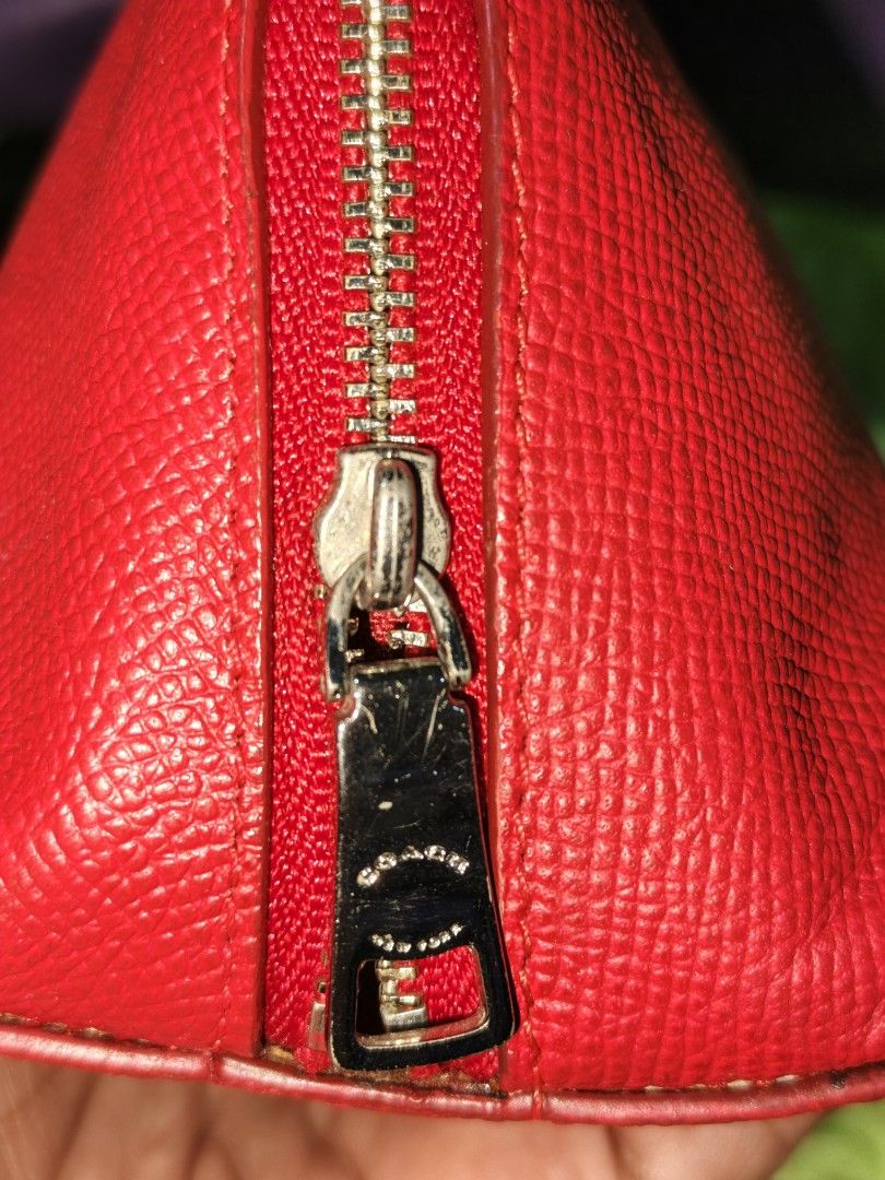 Coach Red Leather Clutch (Category: Clutches) located in Davao. Submitted by ukaystuff07 (Listing ID 1421781033, Image 3). Description: - Authentic Coach clutch - Made of red leather - Zip closure with Coach zipper pull - Red fabric interior - Includes a small pocket - Coach logo on the front - Made in India - Style number: F1544.