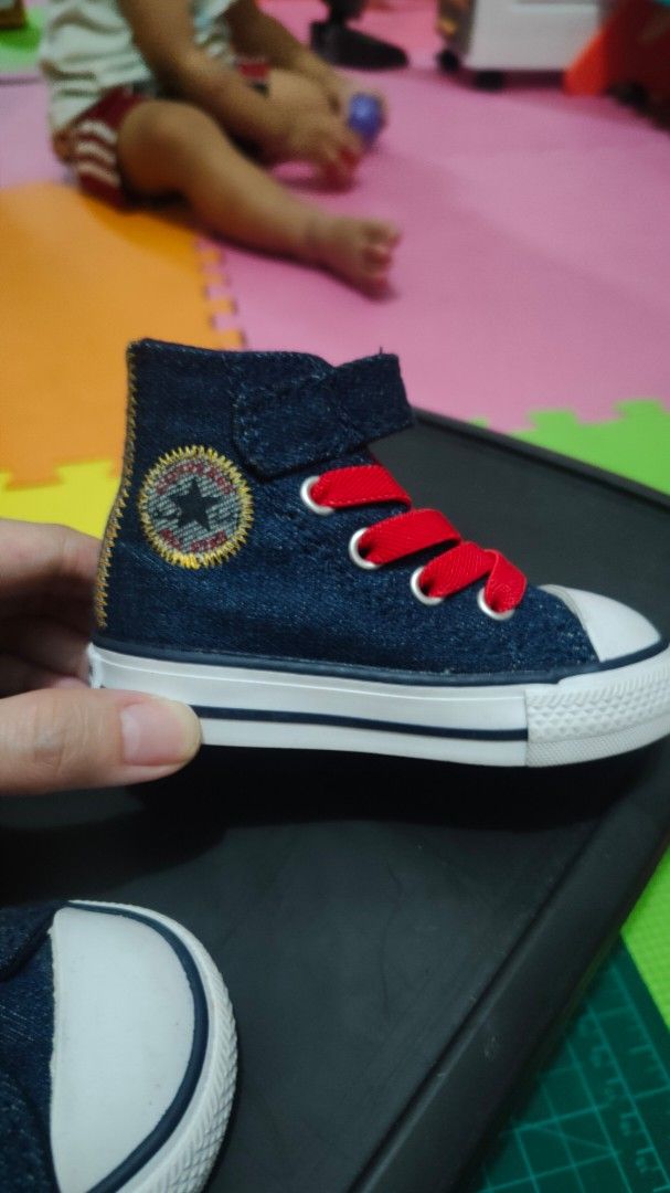 Converse Baby High-Top Sneakers (Category: Babies & Kids Fashion) located in Manila. Submitted by _sinigurl (Listing ID 1421673618, Image 3). Description: - Adorable baby Converse high-top sneakers - Denim-like blue upper - Red laces - White toe cap - Velcro strap for easy on and off - Converse logo on the side - Brown sole with Converse logo - Perfect for your little o.