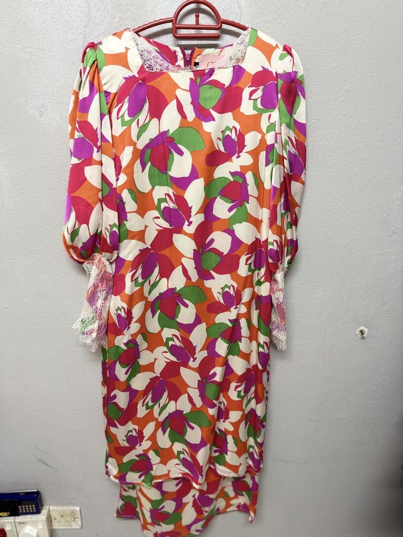 Dewi Diary (Category: Baju Kurung & sets) located in Cheras. Submitted by n_sai (Listing ID 1421702213, Image 1). Description: - Brand: Dewi Diary - Size: S - Features a colorful floral print (orange, pink, green) - Design: Round neckline with lace detailing, long sleeves - Closure: Zipper at the back.