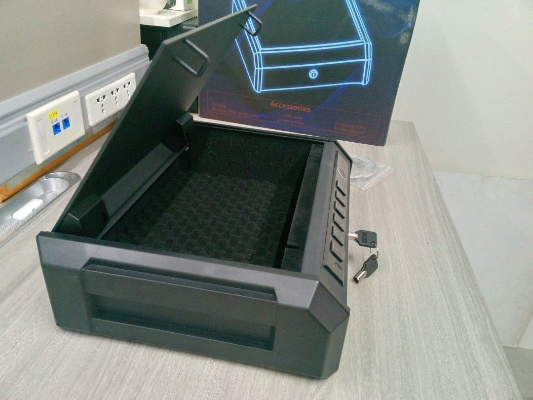 Digital Security Safe Box (Category: Storage Boxes & Baskets) located in Manila. Submitted by online_tindako (Listing ID 1421758346, Image 2). Description: - Digital security safe box - Keypad and fingerprint scanner access - Manual key access included - Protective foam interior - Includes securing cable - Sleek black design.