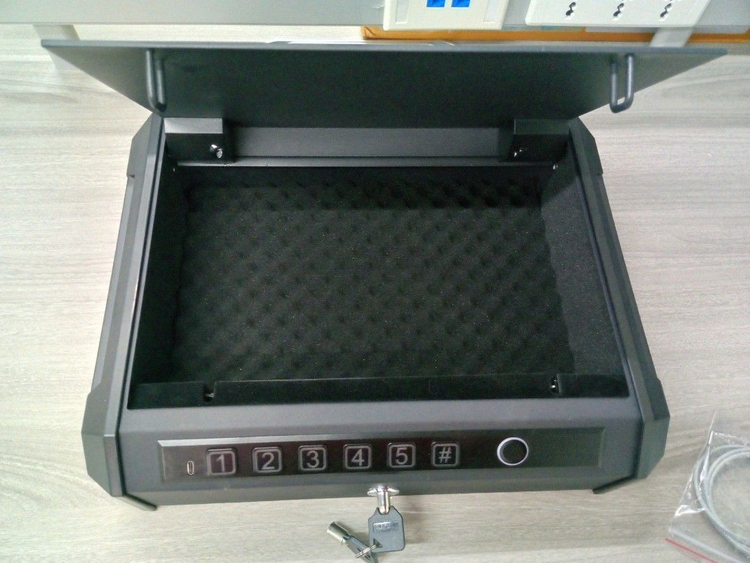 Digital Security Safe Box (Category: Storage Boxes & Baskets) located in Manila. Submitted by online_tindako (Listing ID 1421758346, Image 1). Description: - Digital security safe box - Keypad and fingerprint scanner access - Manual key access included - Protective foam interior - Includes securing cable - Sleek black design.