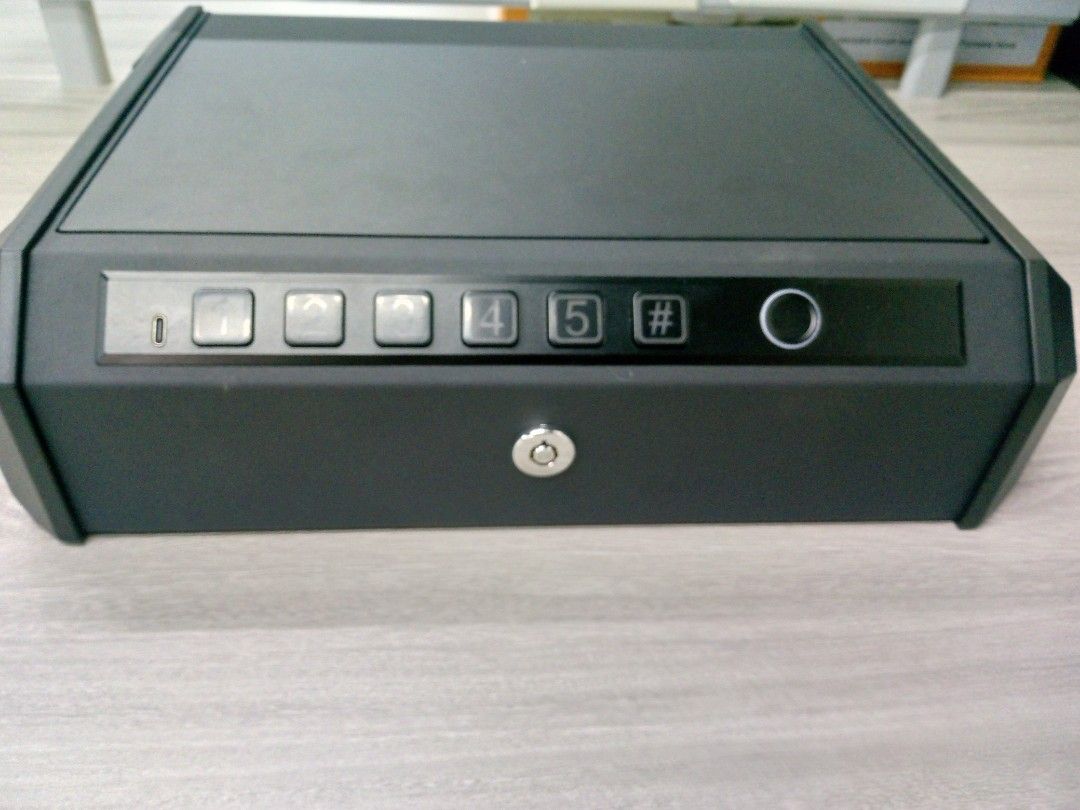 Digital Security Safe Box (Category: Storage Boxes & Baskets) located in Manila. Submitted by online_tindako (Listing ID 1421758346, Image 3). Description: - Digital security safe box - Keypad and fingerprint scanner access - Manual key access included - Protective foam interior - Includes securing cable - Sleek black design.