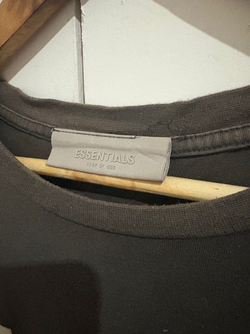 Essentials Fear of God 1977 T-shirt (Category: Tshirts & Polo Shirts ) located in Manila. Submitted by selectors_club26 (Listing ID 1421708386, Image 2). Description: Color rate: 9/10 Dimes: 23x29.5 Issue: loose stitching on neck tag and minor fadings on neck.