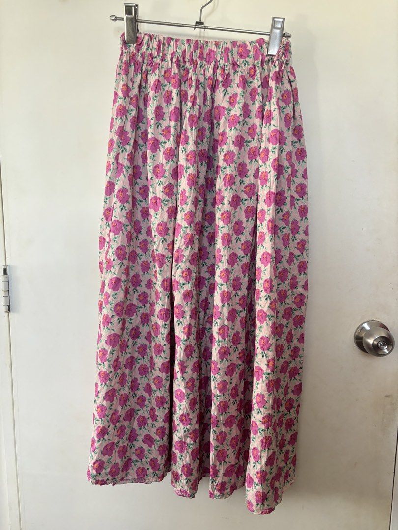 Floral Print Maxi Skirt (Category: Skirts) located in Manila. Submitted by prelovedbymfl (Listing ID 1421641542, Image 1). Description: - Floral print maxi skirt - Features pink and green floral design - Light background - Elastic waistband - Made of lightweight fabric - Flowy silhouette - Ideal for warm weather - fits s-l, stretchy.