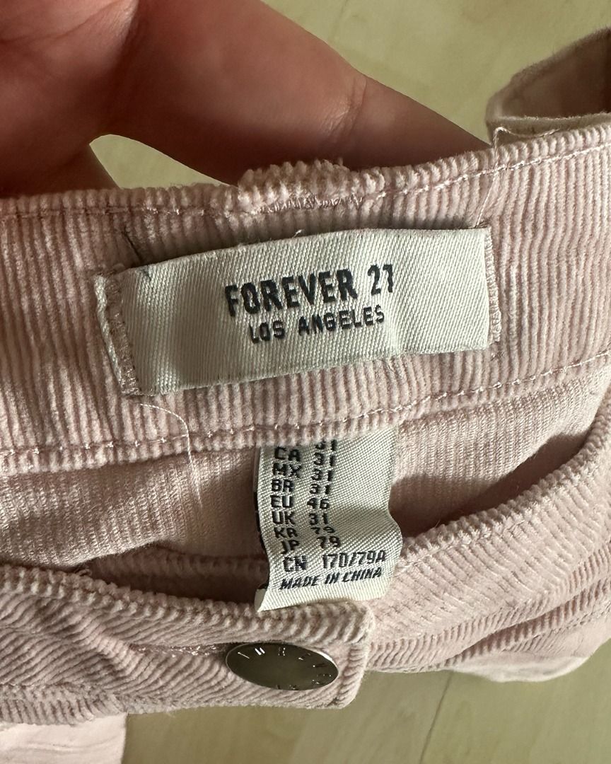 Forever 21 Corduroy Mini Skirt (Category: Skirts) located in Muntinlupa City. Submitted by mmorjo (Listing ID 1421714550, Image 3). Description: - Forever 21 mini skirt - Corduroy fabric - Light pink color - Size 31 - Button-down front - Classic design - Dress up or down.