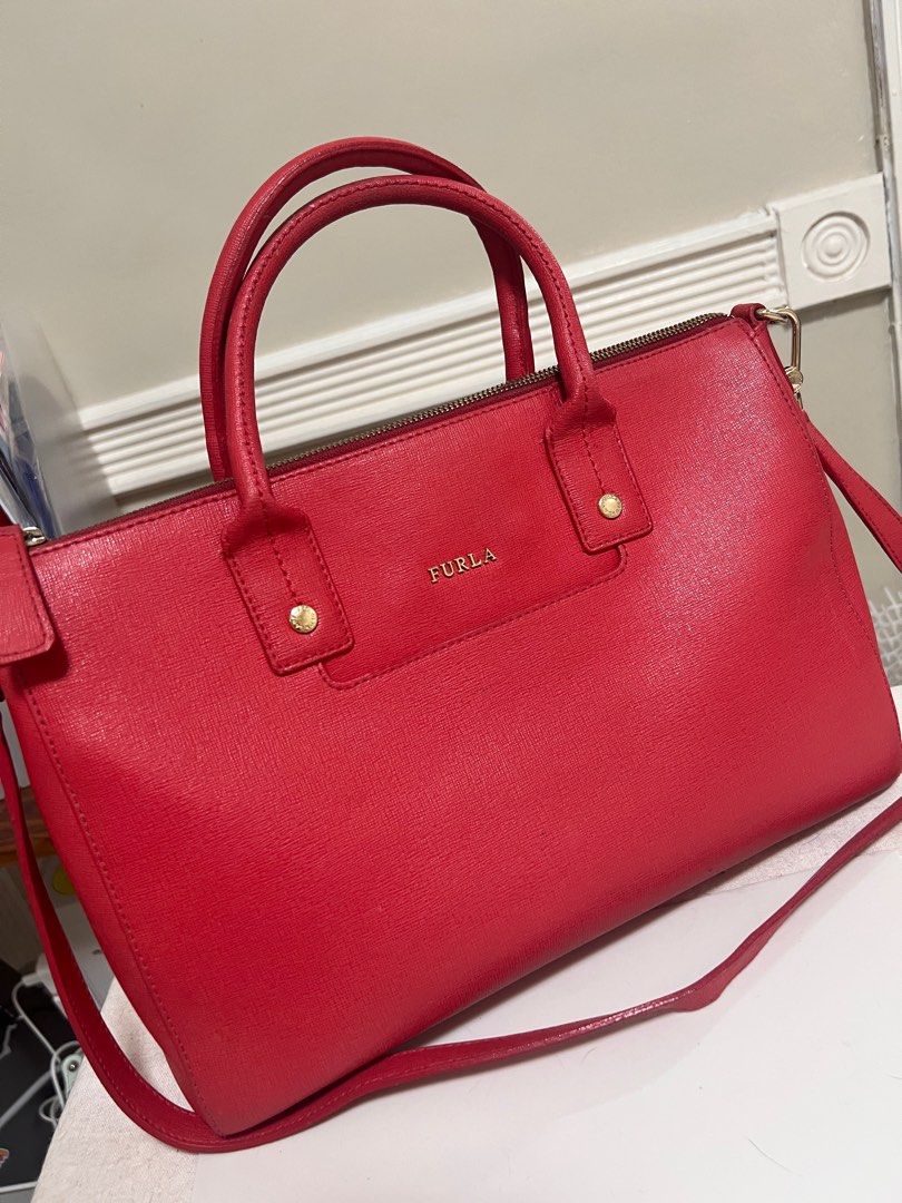 Furla Shoulder Bag (Category: Luxury Bags & Wallets) located in Taguig. Submitted by studio26 (Listing ID 1421688005, Image 1). Description: PLEASE READ THE ENTIRE POST TO SEE ANSWERS TO COMMON QUESTIONS Furla Leather Bag Used with care Dimensions: 12x8x5 inches LOCATION Antipolo / Taguig PAYMENT Cashless payment only. GCash or BPI. DELIVERY To be arranged and shouldered by buyer. .