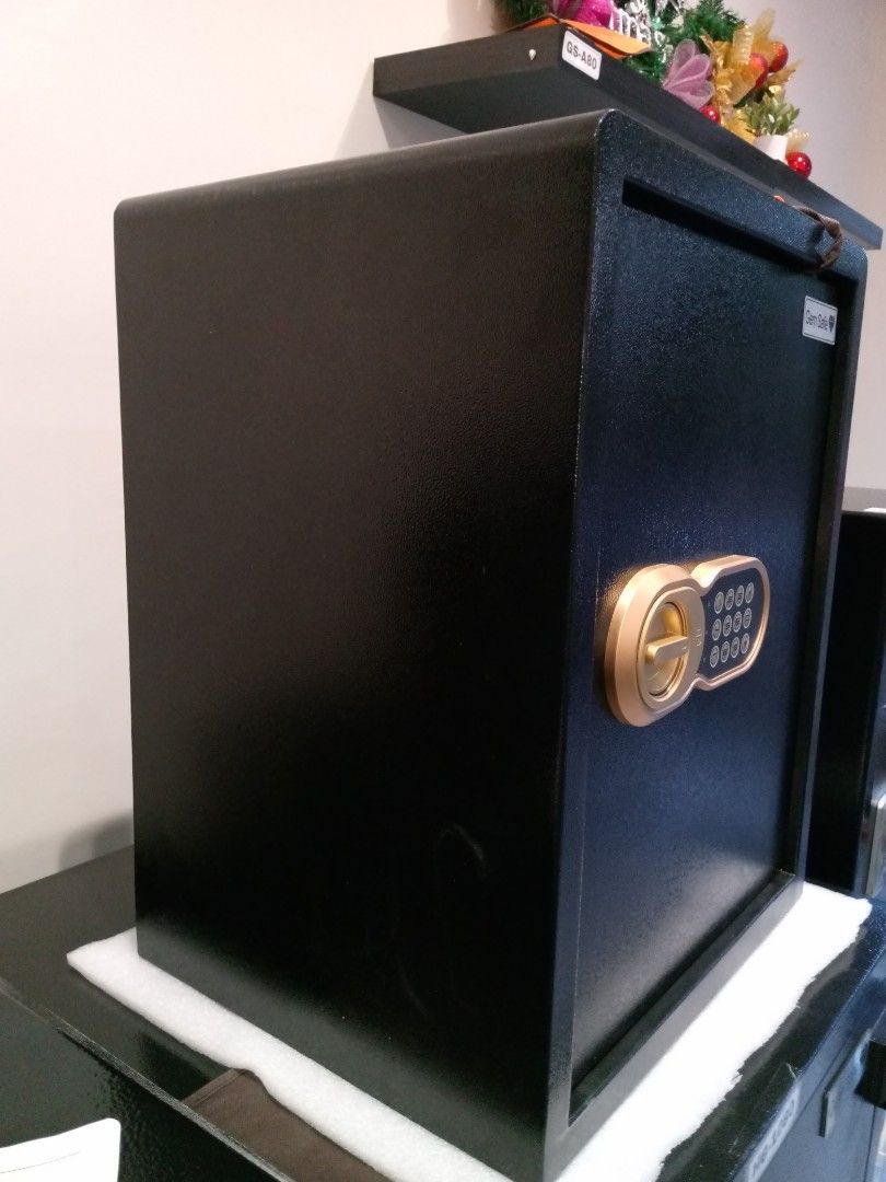 Gem Safe Digital Safe (Category: Safe) located in Manila. Submitted by online_tindako (Listing ID 1421766044, Image 2). Description: - Gem Safe digital safe - Keypad and manual key override - Stylish black exterior with gold dial and keypad - Includes interior shelf and padded bottom - Perfect for securing valuables - external dimension: H50xW40xD33cm.
