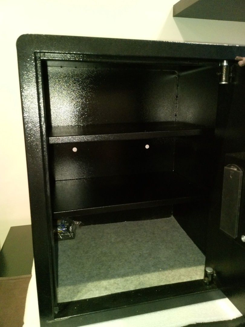 Gem Safe Digital Safe (Category: Safe) located in Manila. Submitted by online_tindako (Listing ID 1421766044, Image 3). Description: - Gem Safe digital safe - Keypad and manual key override - Stylish black exterior with gold dial and keypad - Includes interior shelf and padded bottom - Perfect for securing valuables - external dimension: H50xW40xD33cm.