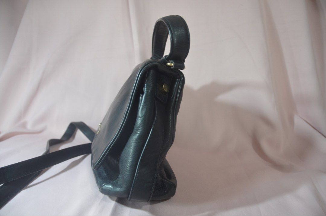 Givenchy Black Leather Handbag (Category: Luxury Bags & Wallets) located in Paranaque City. Submitted by margauxjc39954 (Listing ID 1421755441, Image 3). Description: - Givenchy black leather handbag - Top handle and detachable shoulder strap - Flap closure with Givenchy logo - Single interior compartment - Gold-toned hardware - Classic, structured design.
