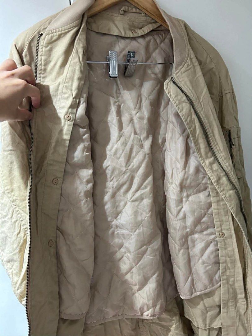 GU Padded Long Jacket (Category: Coats, Jackets and Outerwear) located in Quezon City. Submitted by r_decluttering (Listing ID 1421723385, Image 2). Description: GU Padded Long Jacket With puffer padding Large | W: 23, L: 35, Arm: 19.
