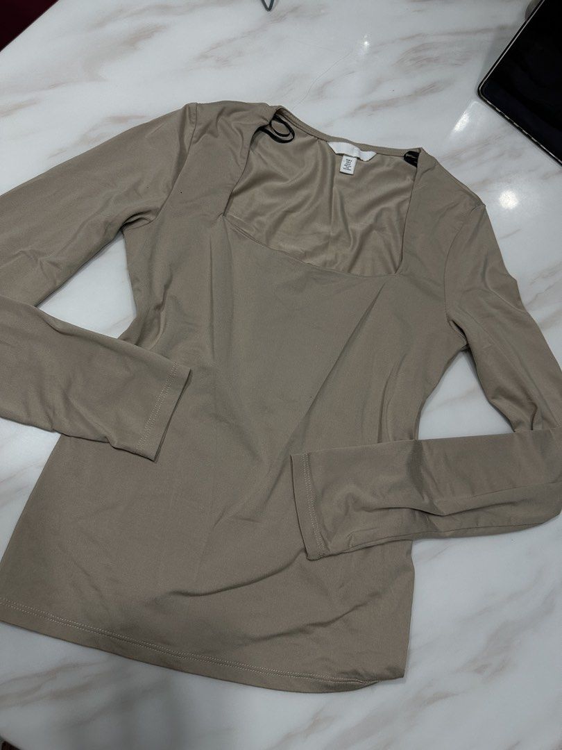 H&M Square Neck Long Sleeve Top (Category: Blouses) located in Quezon City. Submitted by prelovednd21 (Listing ID 1421665532, Image 1). Description: - H&M top - Size: S - Color: Beige - Features: Square neckline, long sleeves - Material: Possibly silky, smooth feel - Design: Simple and elegant - Perfect for various occasions.