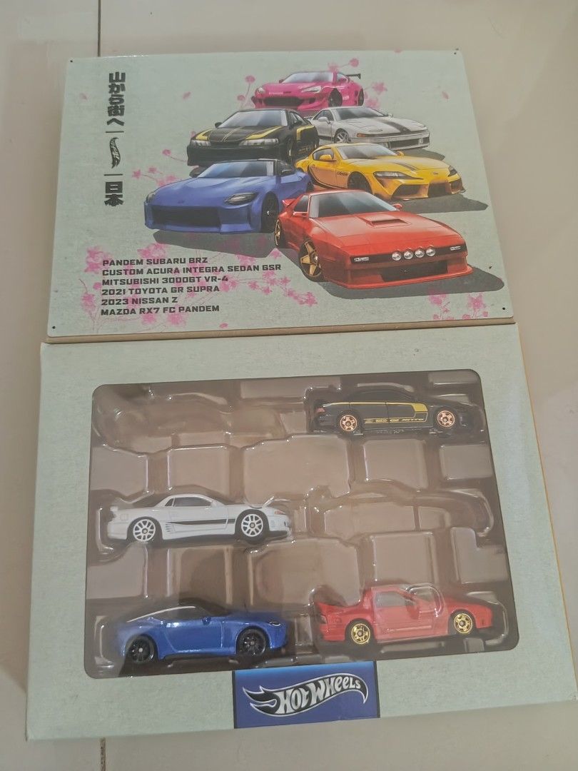Hot Wheels Japanese Car Set (Category: Vehicle & Diecast Models) located in Batangas. Submitted by ranran4812 (Listing ID 1421670660, Image 1). Description: - Hot Wheels Japanese Car Collection - Features: Subaru BRZ, Acura Integra Sedan, Mitsubishi Eclipse, Toyota Supra, Nissan Z, Mazda RX7 - Themed packaging - Includes Hot Wheels logo.