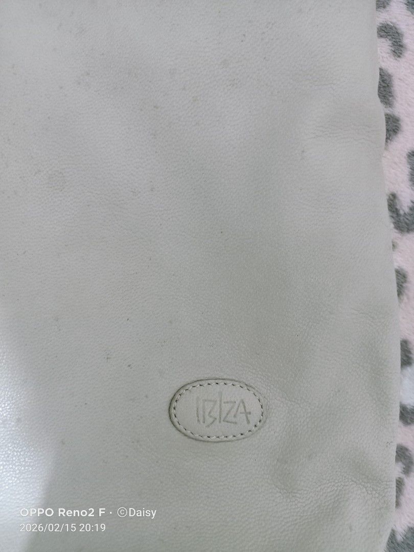 Ibiza Shoulder Bag (Category: Shoulder Bags) located in Quezon City. Submitted by daisyuy1979 (Listing ID 1421734051, Image 2). Description: - Ibiza shoulder bag with woven detail - Main compartment with zipper closure - Interior pocket - Long strap - Includes a small charm - Exterior shows marks and discoloration - Patterned interior lining - Sign of usage on outer part .