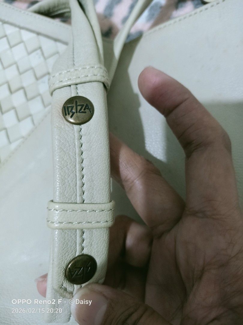 Ibiza Shoulder Bag (Category: Shoulder Bags) located in Quezon City. Submitted by daisyuy1979 (Listing ID 1421734051, Image 3). Description: - Ibiza shoulder bag with woven detail - Main compartment with zipper closure - Interior pocket - Long strap - Includes a small charm - Exterior shows marks and discoloration - Patterned interior lining - Sign of usage on outer part .