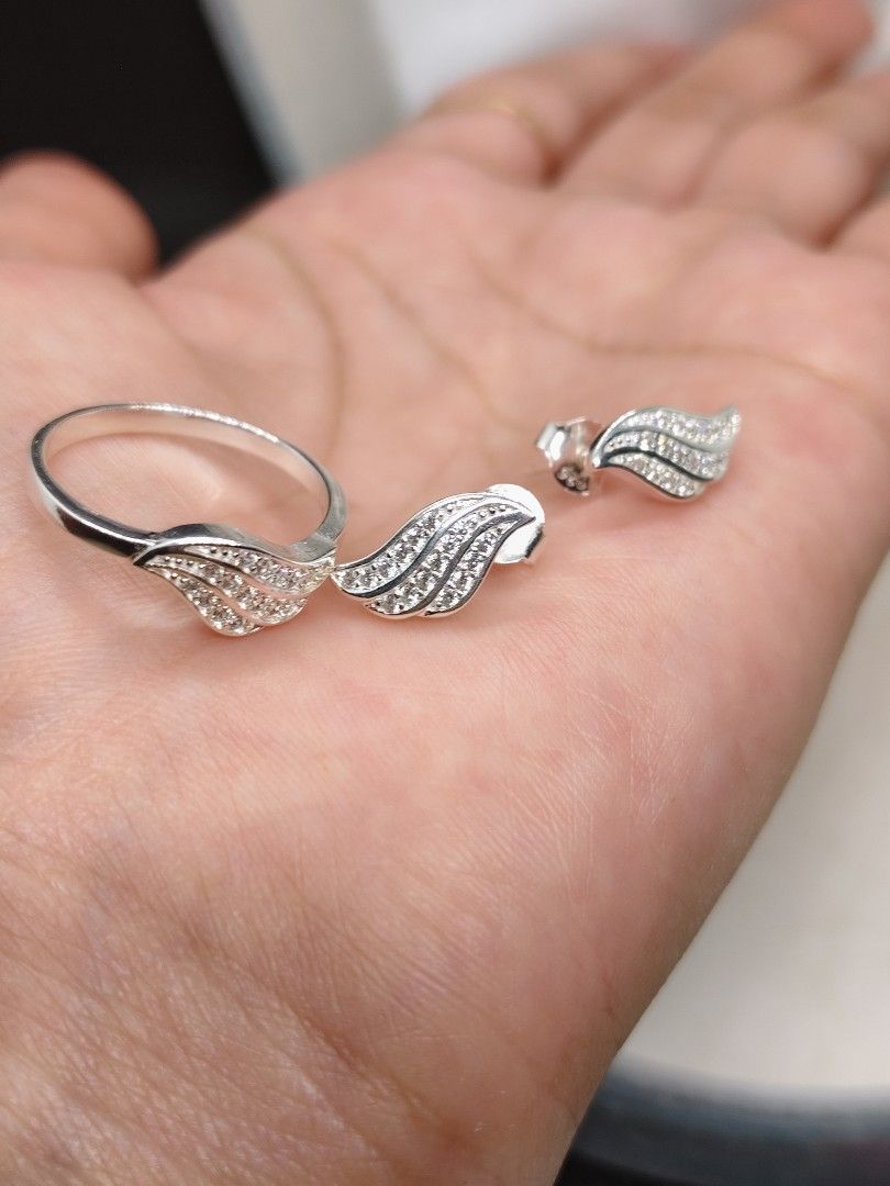Italy silver wing-shaped Ring and Earrings Set (Category: Earrings) located in San Mateo. Submitted by joryee (Listing ID 1421659466, Image 1). Description: -Italy Silver finish ring and earrings set -With 925 markings -Jewelry box , 720 ***Ring size, 7.