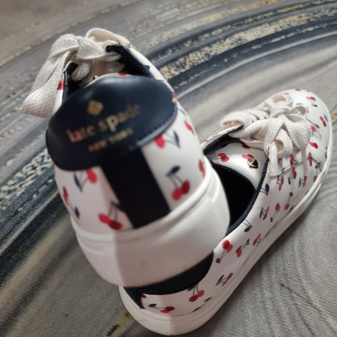 Kate Spade Cherry Print Sneakers (Category: Sneakers) located in Makati City. Submitted by PeppermintPanda (Listing ID 1421681964, Image 3). Description: 💯 Original Kate Spade ❗️ ✅️ BNWOB super nice in actual 🍒 White sneakers with a cherry print. ☁️ Super soft insole (Memory Cloud foam) 💸 MOP: GCash/Bank Transfer 🔥 Same day shipping once paid.