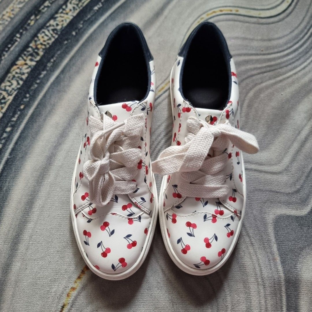 Kate Spade Cherry Print Sneakers (Category: Sneakers) located in Makati City. Submitted by PeppermintPanda (Listing ID 1421681964, Image 1). Description: 💯 Original Kate Spade ❗️ ✅️ BNWOB super nice in actual 🍒 White sneakers with a cherry print. ☁️ Super soft insole (Memory Cloud foam) 💸 MOP: GCash/Bank Transfer 🔥 Same day shipping once paid.