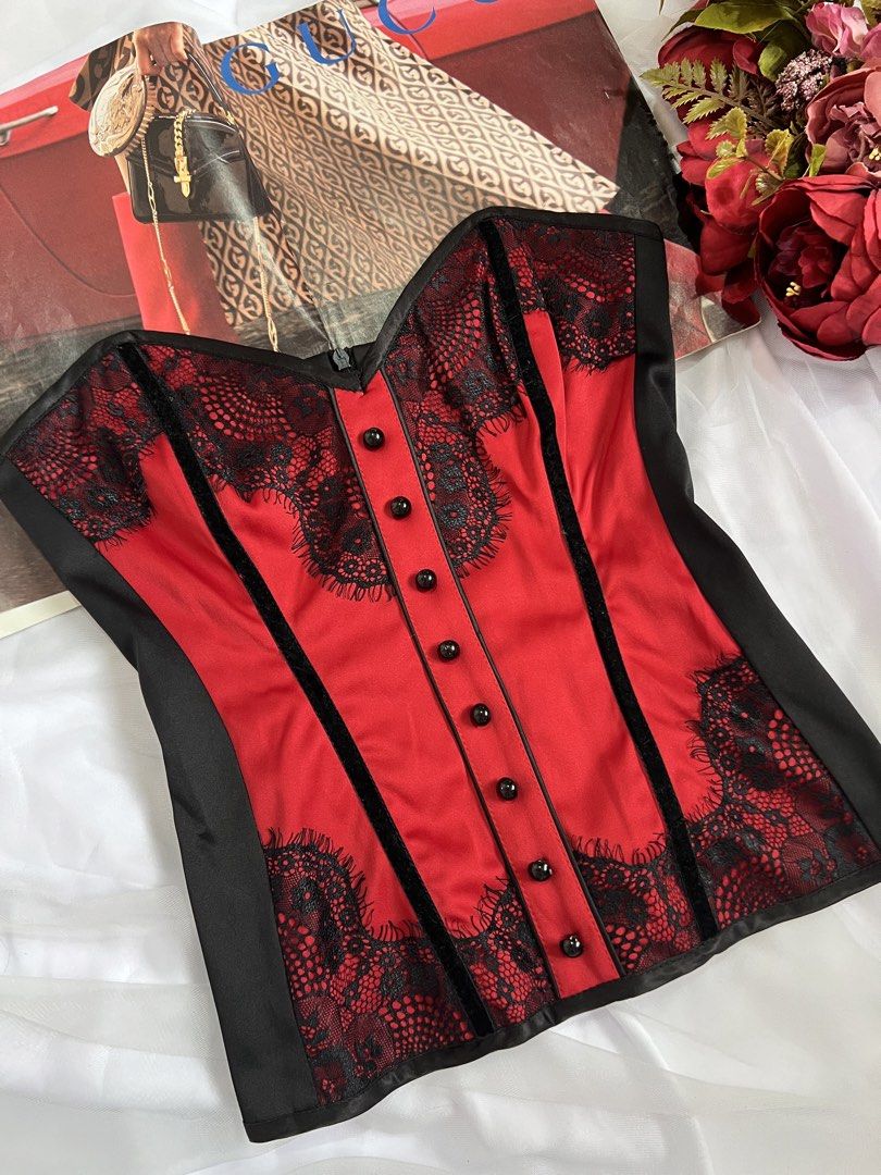Kitten D'Amour Red and Black Corset (Category: Others Tops) located in Las Pinas. Submitted by nakedstudio (Listing ID 1421758480, Image 2). Description: - Kitten D'Amour corset - Red and black color - Strapless design - Satin finish with lace detailing - Features buttons and zipper closure - Size 8 (Fits S 32-34) - Made in Australia - Ideal for special events or vintage looks.