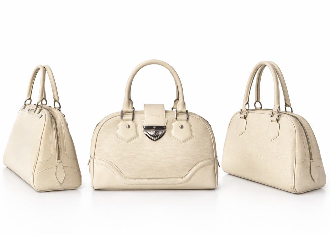 Louis Vuitton Epi Leather Handbag (Category: Luxury Bags & Wallets) located in Manila. Submitted by rotation2000 (Listing ID 1421673477, Image 1). Description: - Authentic Louis Vuitton handbag - Cream-colored Epi leather - Structured shape - Dual top handles - Secure clasp closure - Zip closure - Spacious interior - Elegant design.