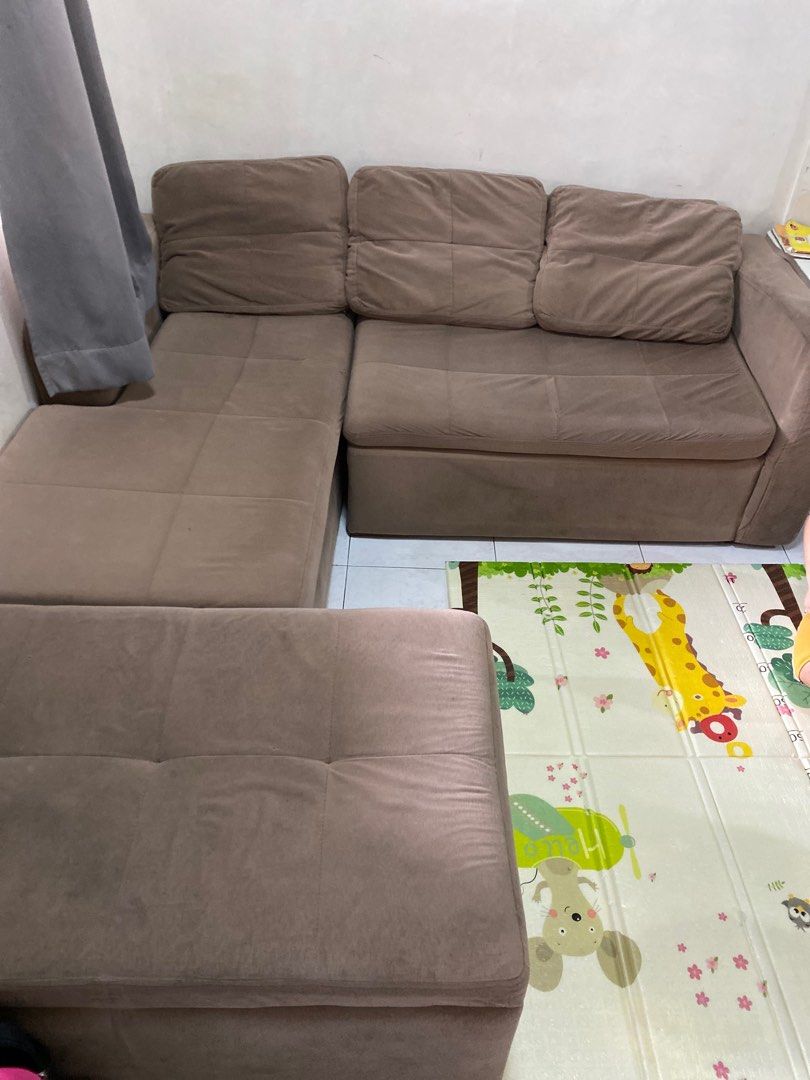 L-Shaped Sofa with Ottoman (Category: Sofas) located in Manila. Submitted by iya0412 (Listing ID 1421642023, Image 2). Description: - L-shaped sofa with ottoman. Ottoman with storage - Neutral brown color - Cushioned design for comfort - Ideal for living rooms and family areas - uratex foam. - bought in sm north furniture department store Rfs: moving out .