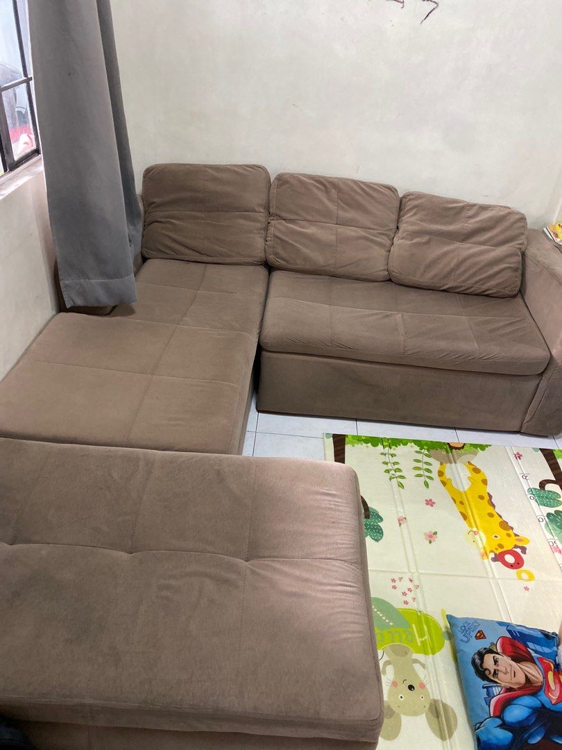 L-Shaped Sofa with Ottoman (Category: Sofas) located in Manila. Submitted by iya0412 (Listing ID 1421642023, Image 3). Description: - L-shaped sofa with ottoman. Ottoman with storage - Neutral brown color - Cushioned design for comfort - Ideal for living rooms and family areas - uratex foam. - bought in sm north furniture department store Rfs: moving out .