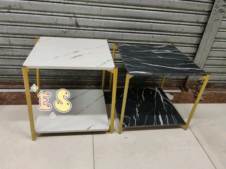 Marble Top Side Table with Gold Frame (Category: Tables & Sets) located in Makati City. Submitted by oideme (Listing ID 1421643614, Image 1). Description: - Stylish side table - Marble-look top - Gold-colored metal frame - Second shelf for storage - Available in black and white marble designs - Square-shaped - Ideal for living rooms and bedrooms.