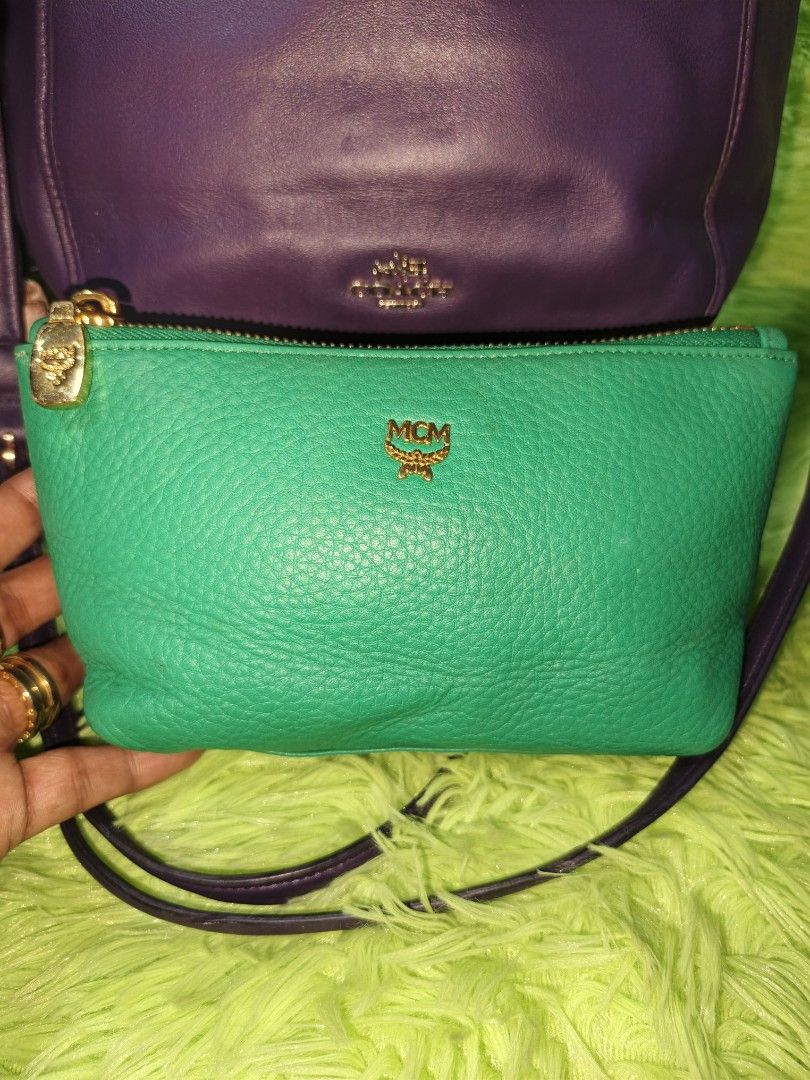 MCM Green Pouch (Category: Luxury Bags & Wallets) located in Davao. Submitted by ukaystuff07 (Listing ID 1421781183, Image 1). Description: - Authentic MCM pouch - Vibrant green color - Gold-toned zipper - MCM logo on front - Matching green satin-like interior lining - Made of textured leather - Rectangular shape with flat bottom -excellent condition.