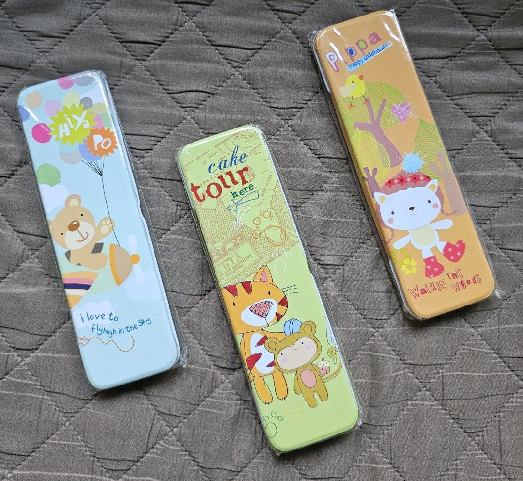 Metal (tin) pencil case (Category: Stationery & School Supplies) located in Quezon City. Submitted by the_l1ttlej0ys (Listing ID 1421763736, Image 1). Description: brand new metal pencil cases Php10 each 3 designs to choose from: - bear in plane with balloons: 1 pc available -cat and bird with trees: 4 pcs available -tiger and monkey with cupcake: 5 pcs available.