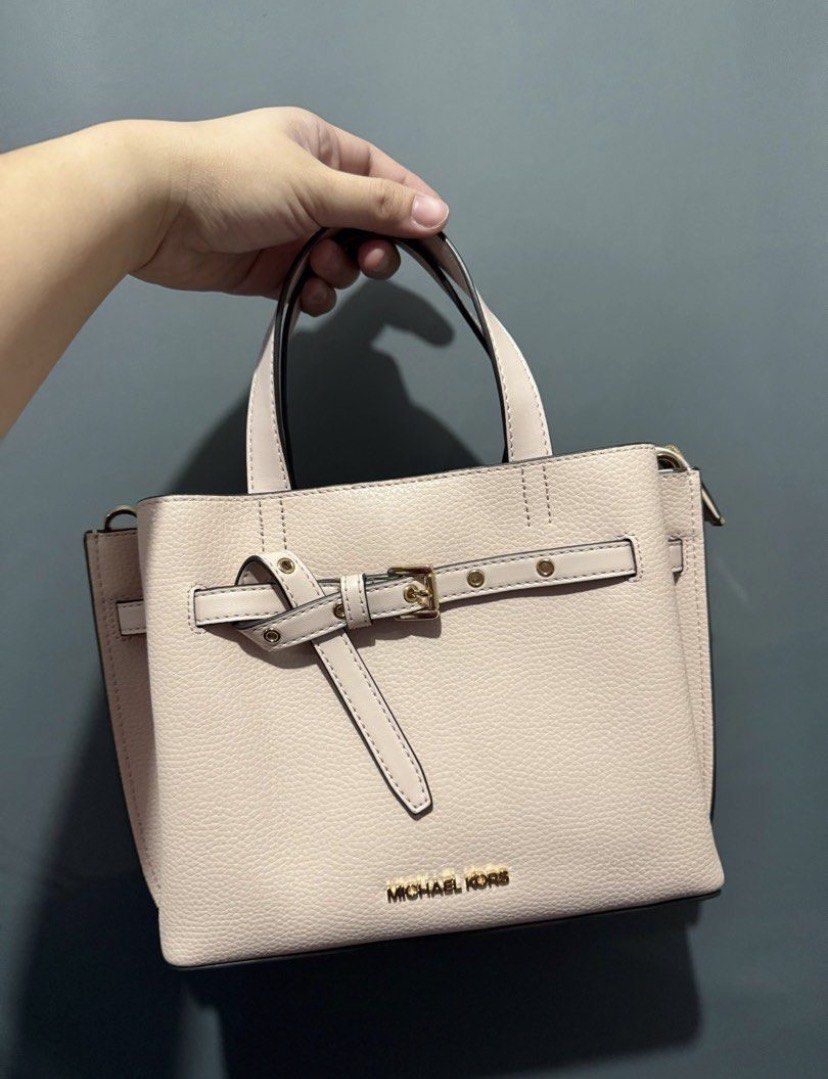 Michael Kors Pink Satchel Bag (Category: Luxury Bags & Wallets) located in Batangas. Submitted by bagstolove2.0 (Listing ID 1421702844, Image 1). Description: - Michael Kors satchel bag - Color: Light Pink - Features: - Top handle - Detachable strap - Buckle closure - Gold-tone hardware - Interior: - Matching fabric lining - Michael Kors logo - Condition: Good.