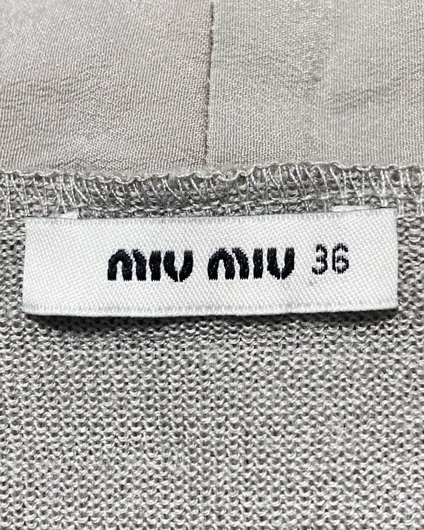Miu Miu - Sequin-Trim Longline Cardigan (Category: Others Tops) located in Angeles City. Submitted by crushedgems (Listing ID 1421658488, Image 3). Description: id: Miu Miu - Sequin-Trim Longline Cardigan A sequin-embellished cardigan from Miu Miu. Made in a soft grey knit with a longline silhouette and open front, the piece is framed by dense sequin detailing along the edges and front panels. Its elongated cut lends a relaxed, fluid feel, while 